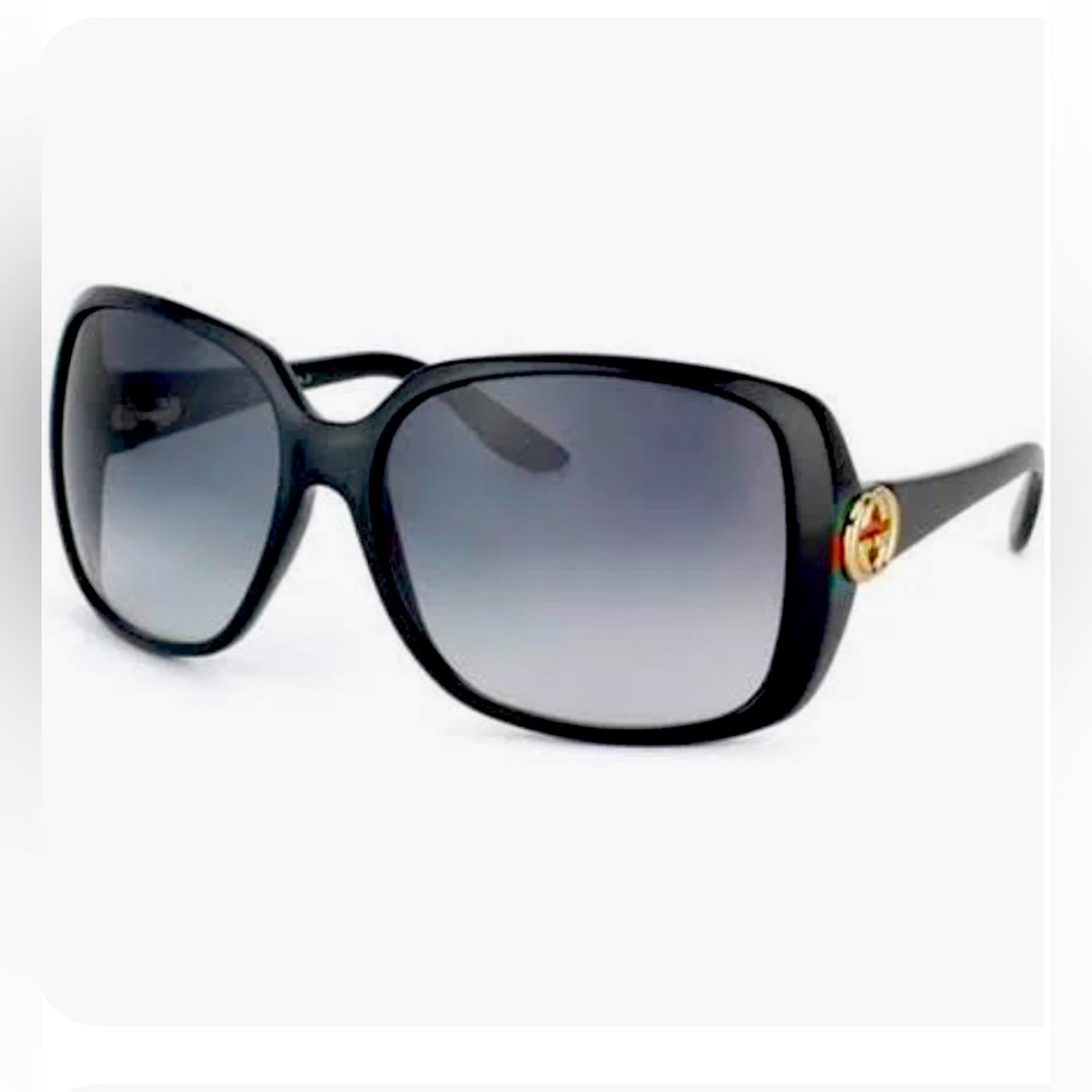 Gucci sunglasses. Gold logo black frame.